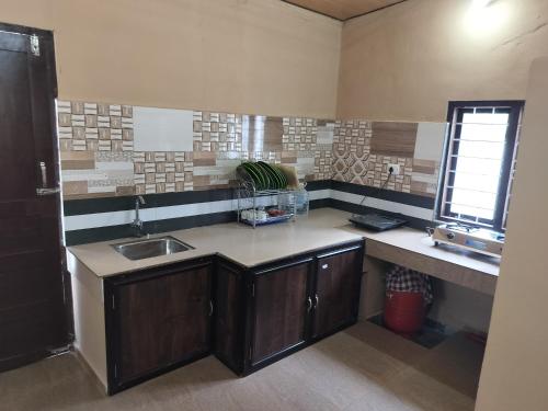 Kuchyň nebo kuchyňský kout v ubytování Pheonix home stay
