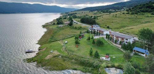 an aerial view of a house on an island in the water at ЕДЕЛВАЙС Сърница in Sarnitsa
