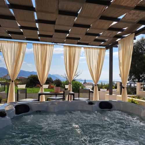 a hot tub in the middle of a patio at Villa Rita in Orebić