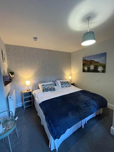 Ein Bett oder Betten in einem Zimmer der Unterkunft Archway Guest House