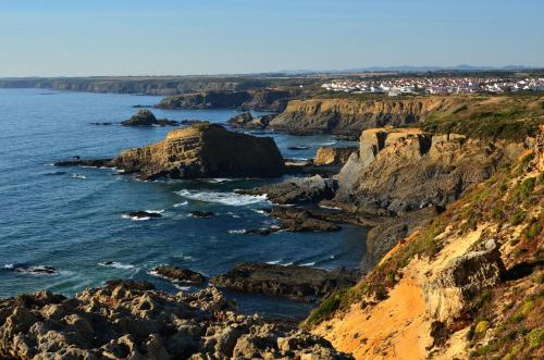 a view of the coast from the cliffs at Casa do Viajante - Family in Zambujeira do Mar