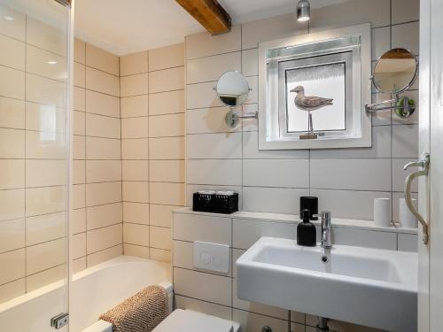 a bathroom with a sink and a toilet and a shower at Pensway in Burpham