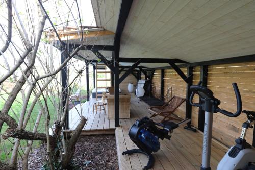 an outside view of a cabin with a gym at LA TOUR des fées-spa in Mittelbergheim