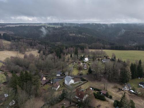 an aerial view of a small village in a forest at Stará škola - Alte Schule, Loučná in Jindřichovice