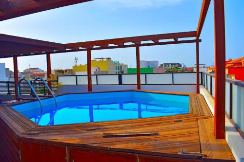 a swimming pool on the roof of a building at Damfjord Boutique Hotel in Santa Maria