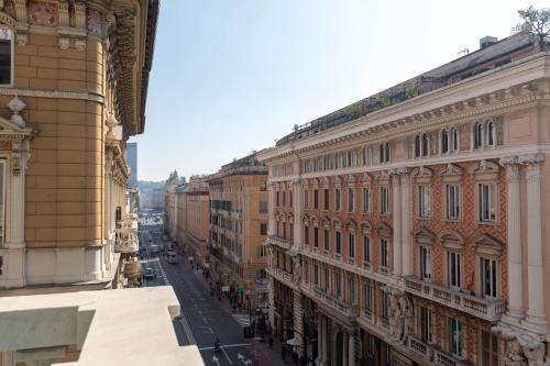 a view of a city street with buildings at Olympia Hotel in Genoa