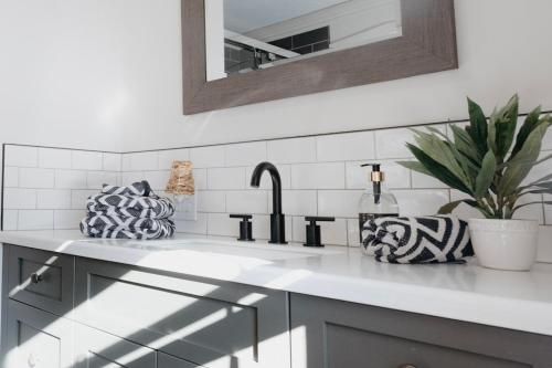 a kitchen counter with a sink and a faucet at The Watson Farm 