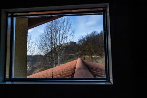 a window on top of a brick building at Monte Moro Gavi B&B in Gavi