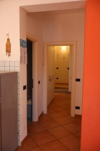 an empty hallway with orange and white walls at Giulio's terraces in the bay in Portovenere