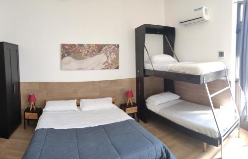 a bedroom with two bunk beds and a bed at La Foresteria in Grottaglie