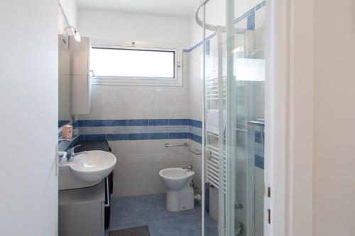 a bathroom with a sink and a toilet and a shower at M6 1BDR Sea View balcony 2mins walk beach garage AC in Roquebrune-Cap-Martin
