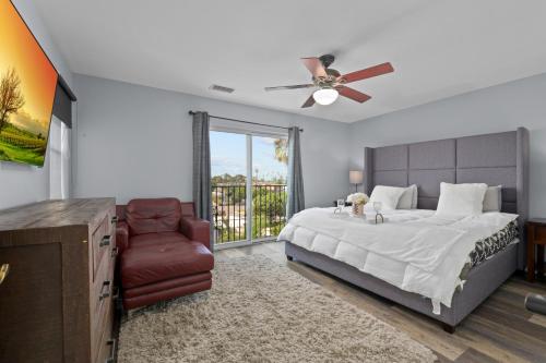 a bedroom with a bed and a ceiling fan at Three Story Spanish Style 3 Story Home in SD best location in San Diego