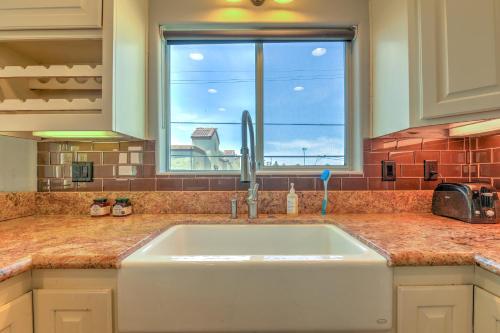 a kitchen with a sink and a window at Three Story Spanish Style 3 Story Home in SD best location in San Diego