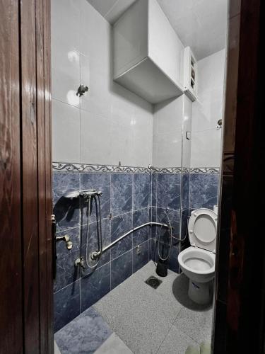 a bathroom with a toilet and a shower at Dar Bennis médina in Rabat