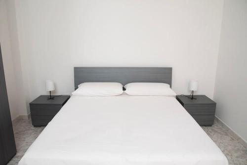 Postel nebo postele na pokoji v ubytování Puglia, Manfredonia nel cuore del Gargano