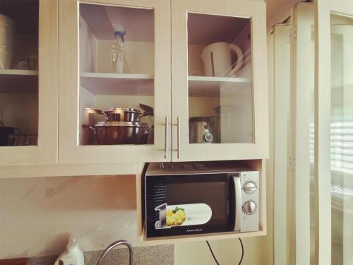 Η κουζίνα ή μικρή κουζίνα στο 2024 Condo Suites, Wi-Fi+Netflix
