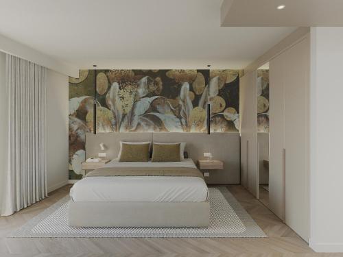 a bedroom with a bed and a painting on the wall at Résidence Apa Nera in Calenzana