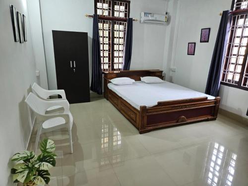 Ένα ή περισσότερα κρεβάτια σε δωμάτιο στο Mo-Hung Homestay