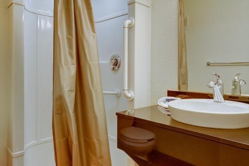 a bathroom with a sink and a toilet and a shower at Motel 6-Eugene, OR - South Springfield in Eugene