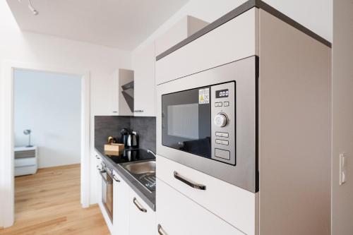 Kuchyň nebo kuchyňský kout v ubytování SYMPHONY Apartments 41 - Modern Loft with Terrace and Grill in Central Location