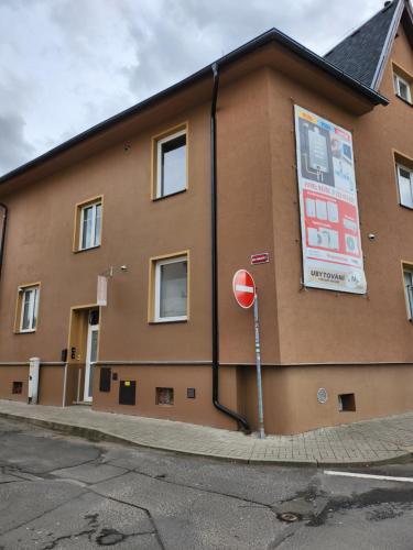 a building with a stop sign in front of it at Ubytováni u PÁji in Kynšperk nad Ohří