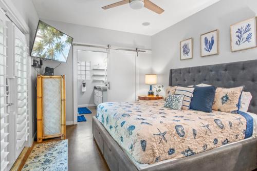 a bedroom with a large bed and a window at Island Time in Port Aransas