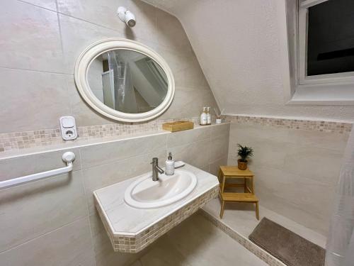 a bathroom with a sink and a mirror at Art-Apartment with Terrace in Monschau in Monschau