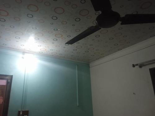 a ceiling with a ceiling fan in a room at Ocean Sparrow Beach Stay in Gokarna