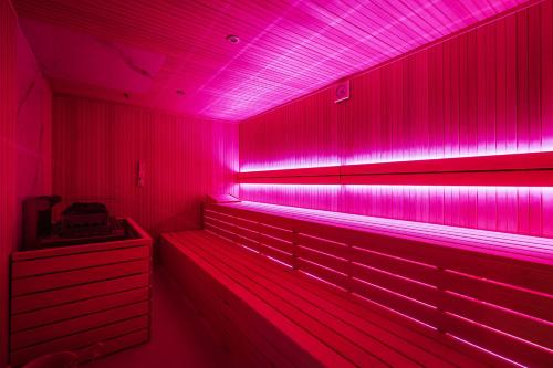 a red lighted room with pink lights in it at Hotel Slatina Superior in Rogaška Slatina
