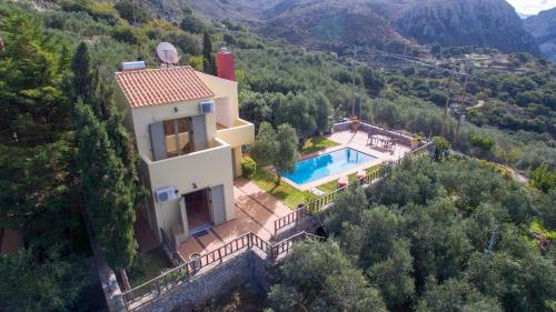 an aerial view of a house with a swimming pool at Malathiros Traditional Villas in Maláthiros
