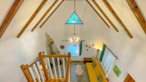 a room with a staircase and a stained glass window at Vilux with indoor private parking in Braşov