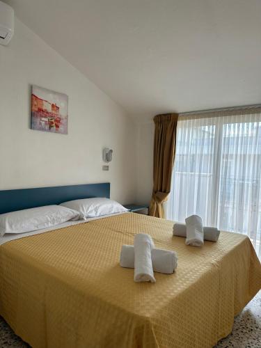 Postel nebo postele na pokoji v ubytování Hotel Till