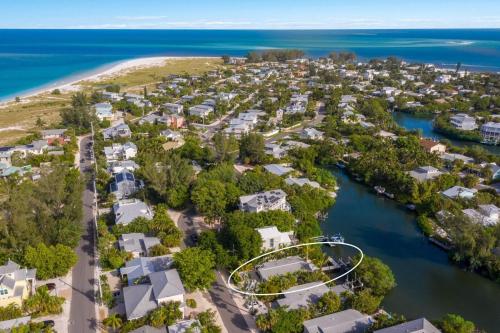 an aerial view of a resort complex next to the water at The Bea's Knees home in Anna Maria