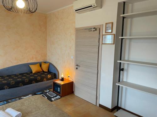 a small room with a bed and a sliding door at Hotel Panoramica in Bardolino