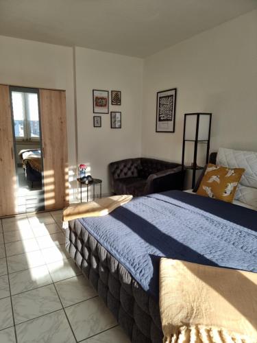 En eller flere senge i et værelse på Moderne Wohnung in Hagen