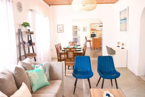a living room with a couch and blue chairs at The ARC in Scarborough