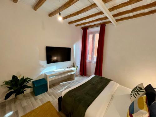 a bedroom with a bed and a tv in a room at Charming Navona in Rome