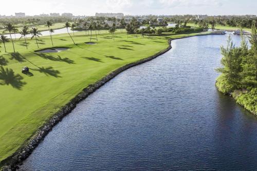 an aerial view of a golf course and a river at The Ritz-Carlton, Grand Cayman in George Town