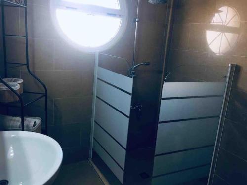a bathroom with a shower and a toilet and a sink at Sol Beach, Cabo Roig in Orihuela Costa