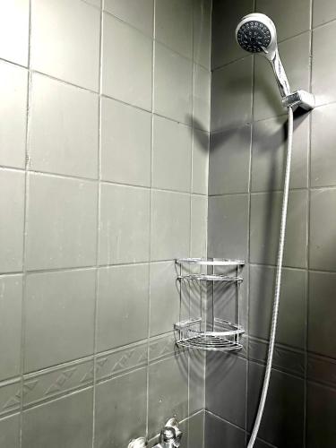 a shower with a shower head in a bathroom at Ekinci Plaza in Istanbul