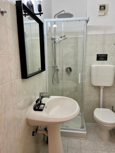 a bathroom with a sink and a shower and a toilet at Charming Navona in Rome