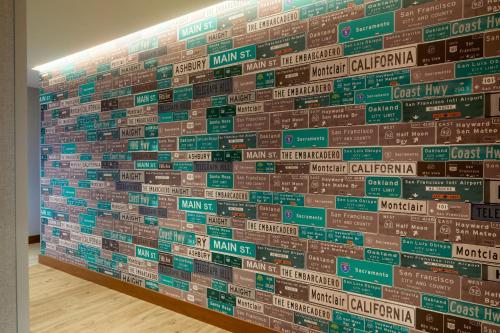 a wall with signs on it in a room at Residence Inn by Marriott San Francisco Airport Millbrae Station in Millbrae