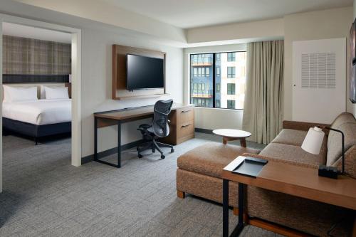 a hotel room with a bed and a desk at Residence Inn by Marriott San Francisco Airport Millbrae Station in Millbrae