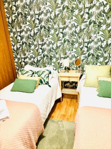 Ένα ή περισσότερα κρεβάτια σε δωμάτιο στο Lula Apartamento