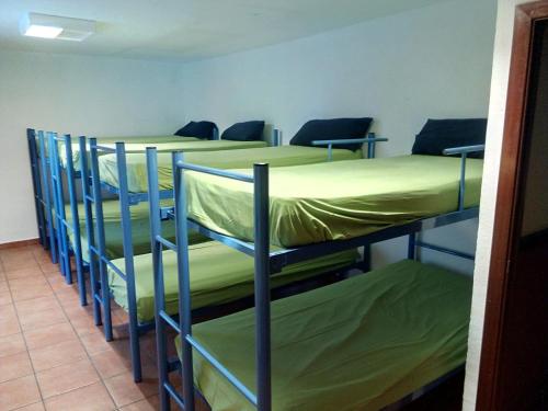 a group of four bunk beds in a room at Albergue de Canfranc Estación in Canfranc-Estación