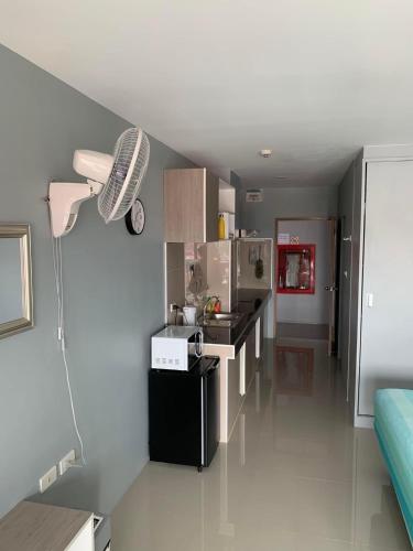 a kitchen with a sink and a counter top at Beach Front Condo Centerviews Bangsaray Floor 6 in Bang Sare