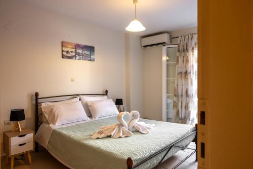 Katil atau katil-katil dalam bilik di Pavlos Apartments