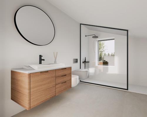 La salle de bains est pourvue d'un lavabo et d'un miroir. dans l'établissement Villa Palms, à Lido di Jesolo