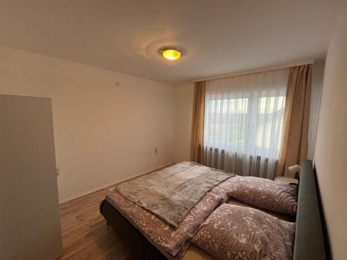 a bedroom with a bed in front of a window at Ferienwohnung in Bad Honnef in Bad Honnef am Rhein