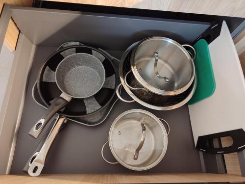 a box filled with pans and utensils at Casa Vacanze - Green Garden in Ledro